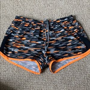 Orange, black, and grey camo nike dri fit shorts
